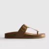 Sandalias tipo mule con barra en T y hebilla