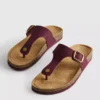 Sandalias tipo mule con barra en T y hebilla