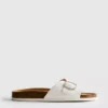 Sandalias tipo mule con correa y hebilla
