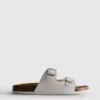 Sandalias tipo mules con doble correa de hebilla