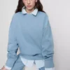 Sudadera oversize con hombros caídos