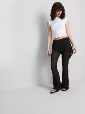 The Primark Scene | Pantalones con falda de malla superpuesta