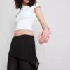 The Primark Scene | Pantalones con falda de malla superpuesta