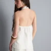 Top con cuello halter y botones, de textura