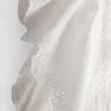 Top de algodón bordado con mangas festoneadas