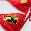 Top de bikini triangular con diseño de tucán