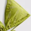 Top de bikini triangular con peces bordados
