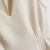 Top sin mangas con peplum y escote en V