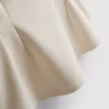 Top sin mangas con peplum y escote en V