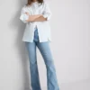 Vaqueros acampanados de algodón denim de talle medio