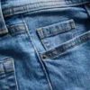 Vaqueros acampanados de algodón denim de talle medio