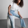 Vaqueros acampanados de denim de algodón de talle medio