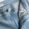 Vaqueros acampanados de denim de algodón de talle medio