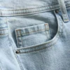 Vaqueros acampanados de denim de algodón de talle medio