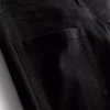 Vaqueros acampanados de denim de algodón de talle medio