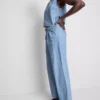 Vaqueros de algodón denim con pliegues y pernera ancha