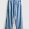 Vaqueros de algodón denim con pliegues y pernera ancha