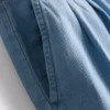 Vaqueros de algodón denim con pliegues y pernera ancha