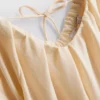 Vestido mini tipo smock con mangas abullonadas
